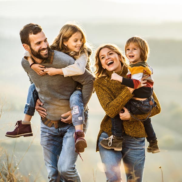 smiling family of four